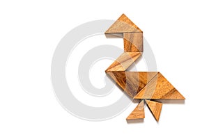 Wood tangram in walking swan or duck shape on white background