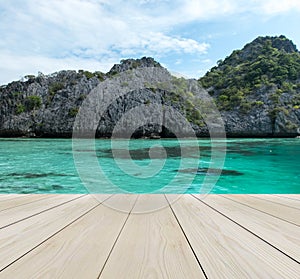 Wood Terrace on The Beach with Clear Sky, Crystal Clean and Clear Sea and Big Island in Myanmar in Scenery Background for Mock up