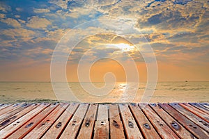 Wood Terrace on The Beach with Sunset background