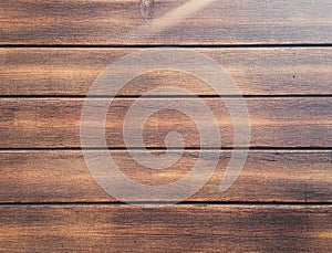 Wood texture background, dark weathered rustic oak. faded wooden varnished paint showing woodgrain texture. hardwood washed planks