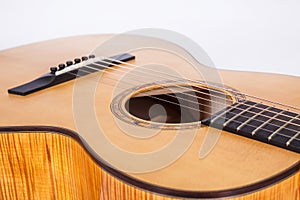 Wood texture of lower deck of six strings acoustic guitar on white background. guitar shape