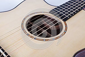 Wood texture of lower deck of six strings acoustic guitar on white background. guitar shape