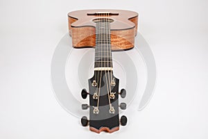 Wood texture of lower deck of six strings acoustic guitar on white background. guitar shape