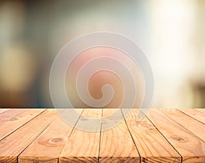 Wood texture table top counter bar with blur light abstract bokeh in cafe,restaurant background