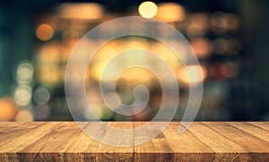 Wood texture table top counter bar with blur light gold bokeh in cafe,restaurant background