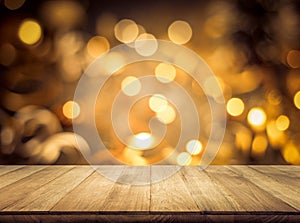 Wood texture table top counter bar with blur light gold bokeh in cafe,restaurant background photo