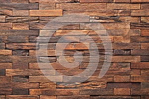 Wood texture wall panel made of small planks. brown planks as background