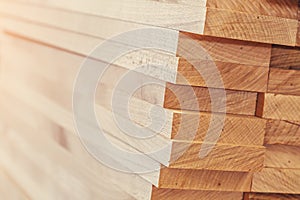 Wood timber construction material for background and texture. close up. Stack of wooden bars. small depth of field.