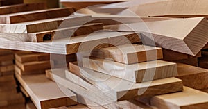 Wood timber construction material for background and texture. close up. Stack of wooden bars. small depth of field.