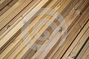 Wood, timber, construction material stacked in the warehouse