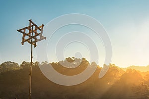 Wood turbine with mountain during sunrise background. Natural summer landscape