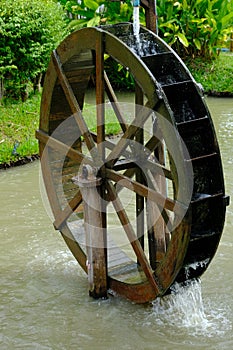 Wood water wheel in the garden