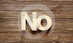 Wood word no on a wooden texture background