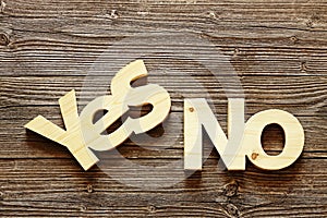 Wood words yes and no on wood texture background