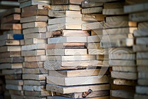 Wood working industry stack of wooden planking lath board joist table close up front view.