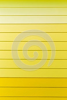 Wood yellow background.yellow Synthetic wood wall texture use for background.