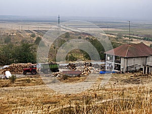 Woodcutter and storage and the agriculture fields landscape 