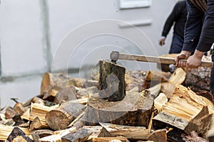 Woodcutters who break wood with an axe