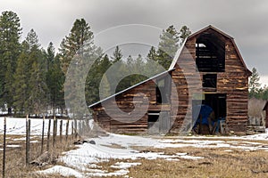Wooded Barn in a snowy field
