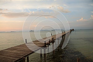 Wooded bridge stretches across the sea