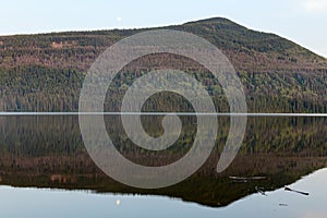 Wooded hills across the lake at Gwillim Lake Provincial Park, British Columbia, Canada