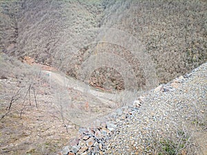 A wooded vally and road in the Highlands of near Kocani,