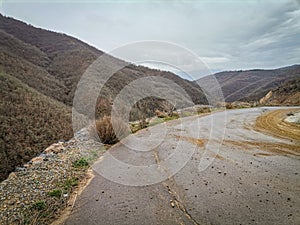 A wooded vally and road in the Highlands of near Kocani,