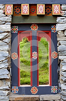 Wooded window and rock wall