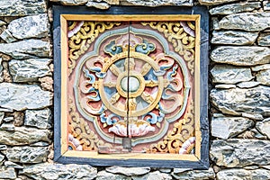 Wooded window and rock wall from bhutan