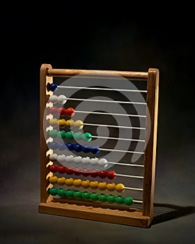 Wooden Abacus With Colored Beads Isolated on Dark Background. Navi Mumbai