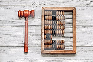 Wooden abacus with judge gavel for sentencing on white background. photo