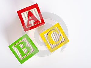 Wooden ABC blocks on white background