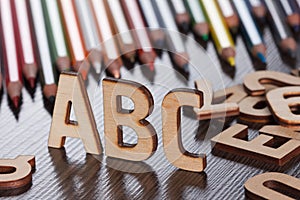 Wooden abc letters school background concept