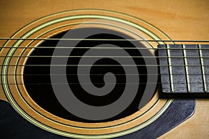 Wooden acoustic guitar bar. detail of classic guitar