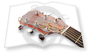 Wooden acoustic guitar on opened photobook isolated on white background