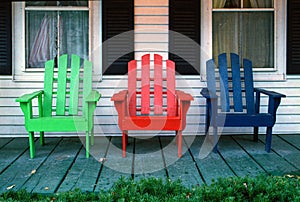 Wooden Adirondack Chairs on a Wooden Porch