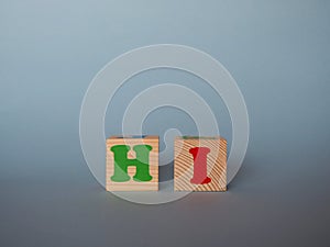 Wooden alphabet ABC toy blocks with the text: hi.