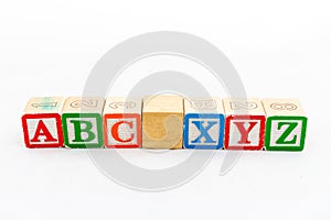 Wooden alphabet blocks ABC and XYZ isolated on white background