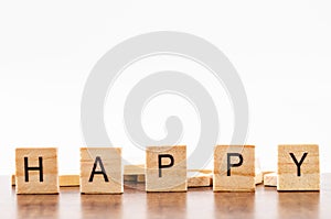 Wooden Alphabet Blocks spelling the word Happy