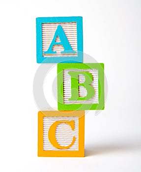 Wooden alphabet blocks stacked