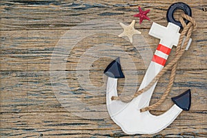 Wooden anchor on the decorative background