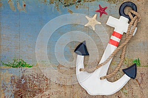 Wooden anchor on the decorative background