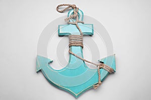 Wooden anchor figure on light background, top view