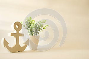 Wooden anchor with tree in pot vintage decorative background