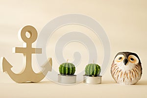 Wooden anchor in vintage with owl and candle cactus decorative background