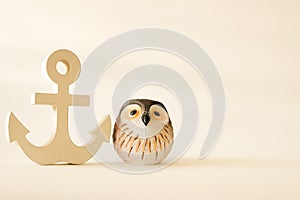 Wooden anchor in vintage with owl decorative background