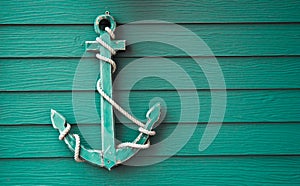 Wooden anchor on wall background