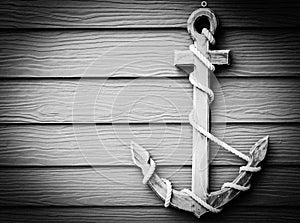 Wooden anchor on wall vintage background