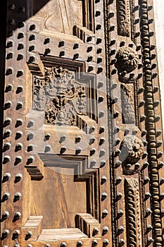 Wooden ancient  door of Pistoia Baptistery, Italy