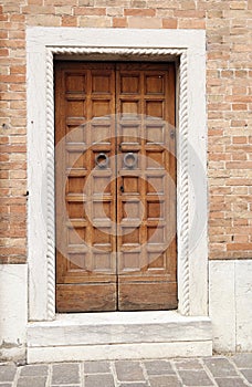 Wooden ancient Italian door in Montagnana, Padova